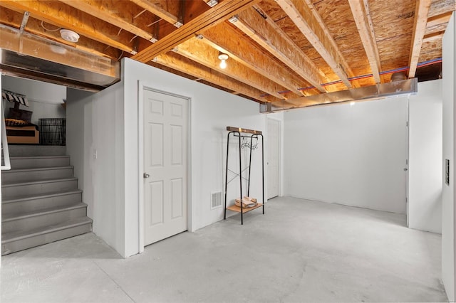 finished basement featuring stairway