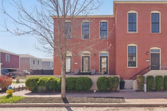 view of property featuring brick siding