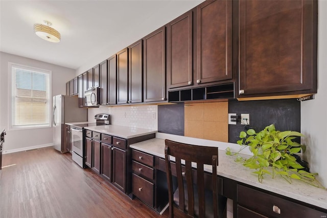 kitchen with backsplash, stainless steel appliances, and dark brown cabinetry