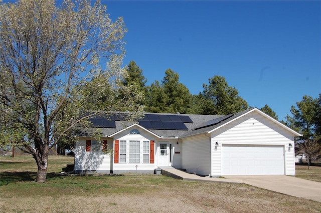 single story home with an attached garage, driveway, crawl space, a front yard, and roof mounted solar panels