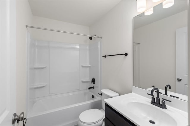 full bath featuring toilet, vanity, and tub / shower combination