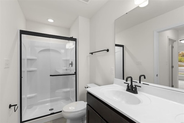 full bath with toilet, vanity, recessed lighting, and a shower stall