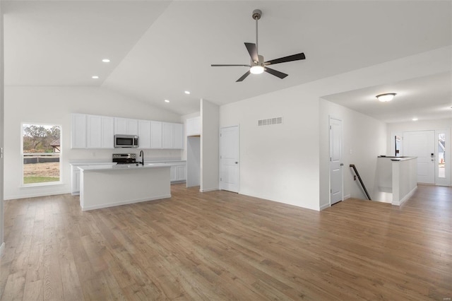 kitchen featuring open floor plan, visible vents, and appliances with stainless steel finishes