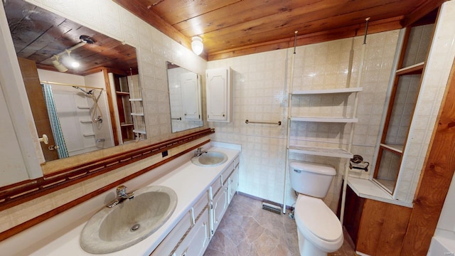 full bathroom with double vanity, a sink, wood ceiling, and toilet