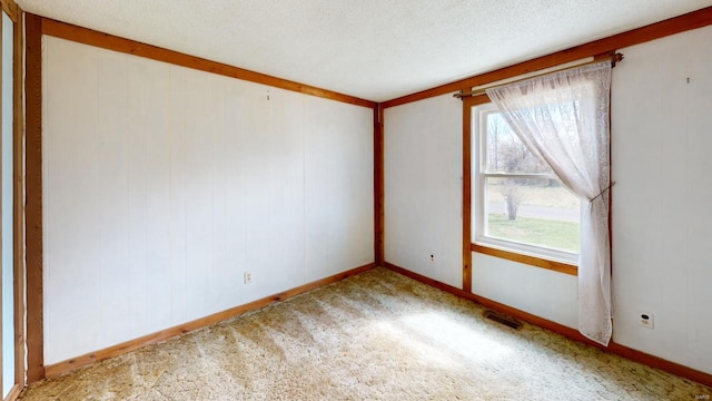carpeted empty room with visible vents