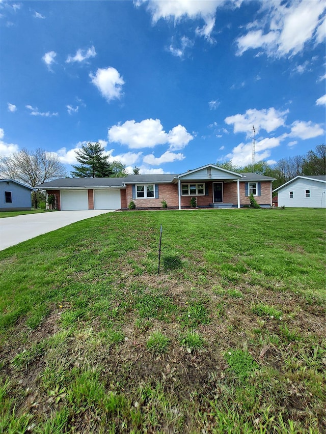 ranch-style house with covered porch, a front yard, driveway, and brick siding
