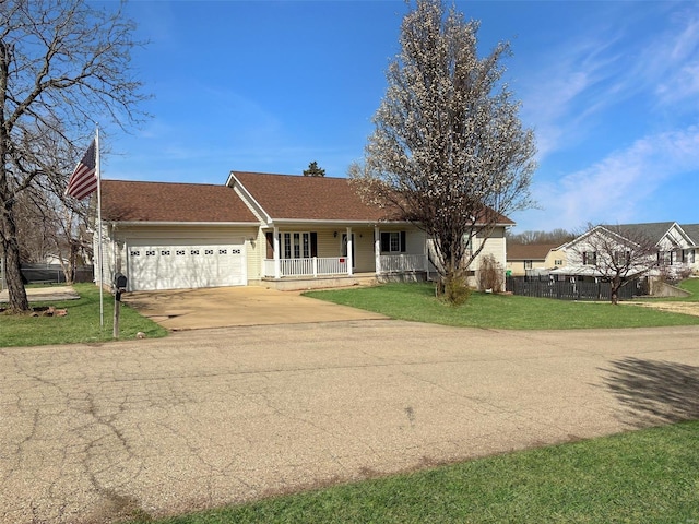 single story home featuring covered porch, concrete driveway, fence, a front lawn, and a garage