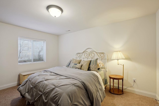 bedroom with carpet floors and baseboards
