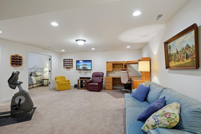 living area with built in study area, baseboards, light colored carpet, visible vents, and recessed lighting