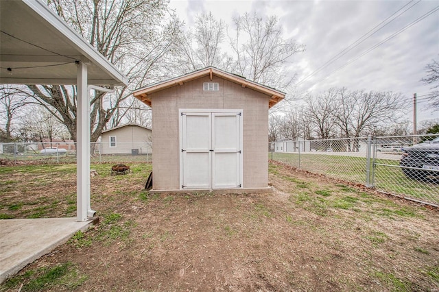 view of shed featuring a fenced backyard