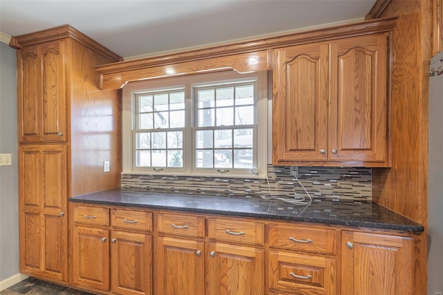 kitchen featuring tasteful backsplash and brown cabinetry