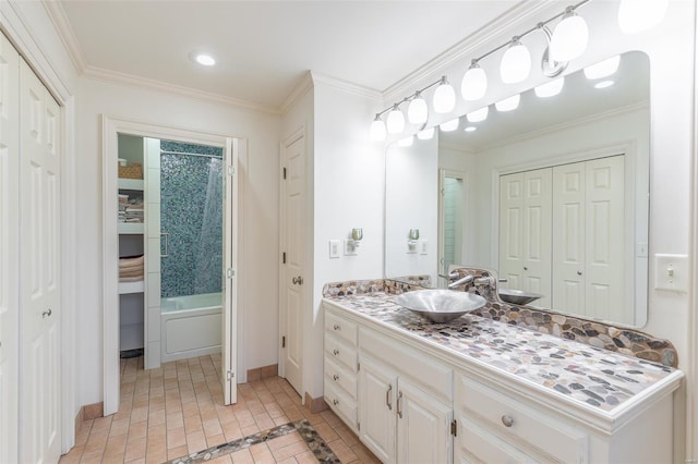 bathroom featuring vanity, shower / bathtub combination with curtain, crown molding, baseboards, and a closet