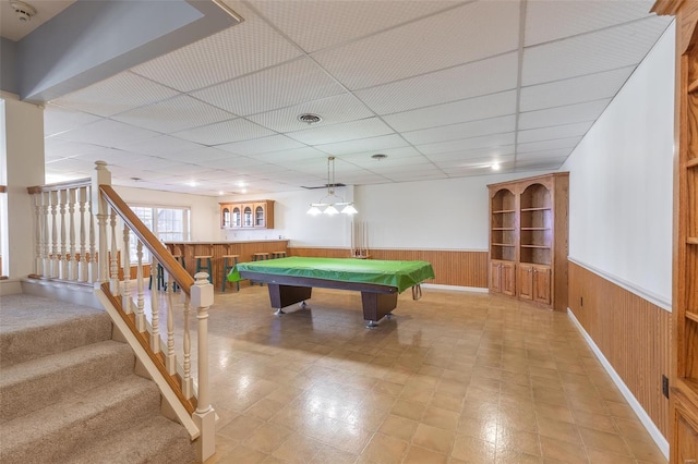 rec room with wood walls, a drop ceiling, a wainscoted wall, visible vents, and billiards