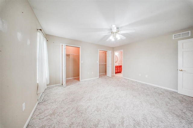 unfurnished bedroom with visible vents, carpet, and baseboards