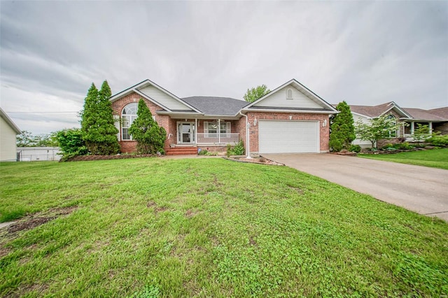 single story home with a front lawn, brick siding, concrete driveway, an attached garage, and a porch