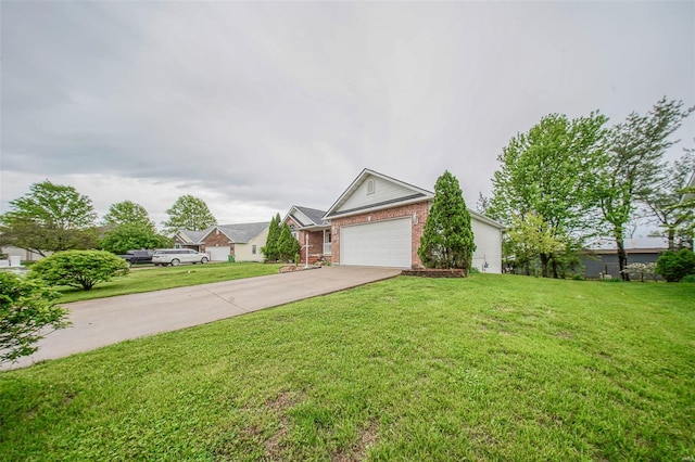 view of front of home with brick siding, a garage, a front lawn, and driveway
