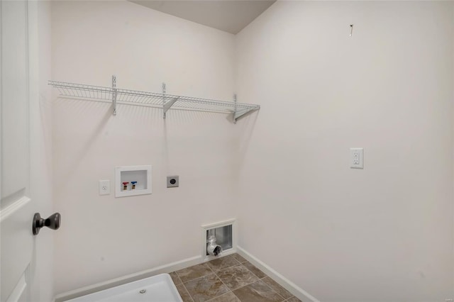 clothes washing area with hookup for an electric dryer, laundry area, baseboards, and washer hookup