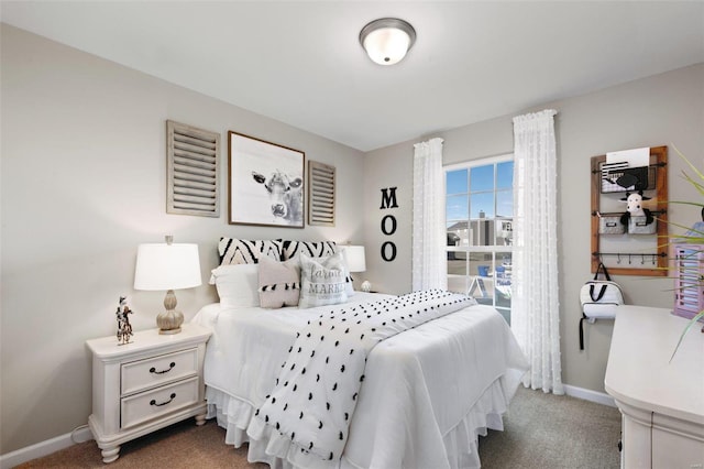 bedroom featuring baseboards and carpet floors