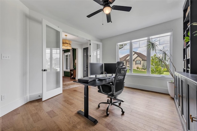 office featuring french doors, light wood-type flooring, baseboards, and ceiling fan