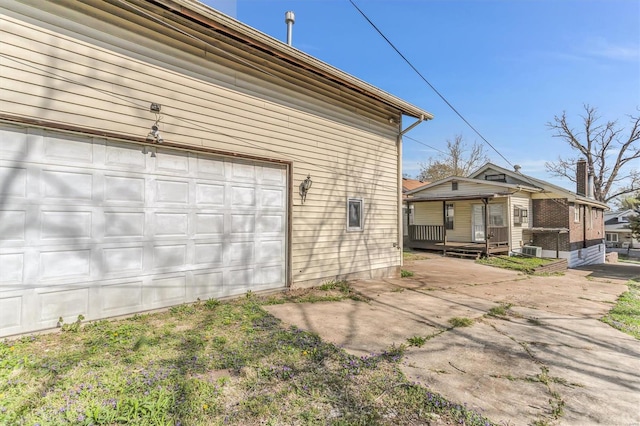 view of side of property featuring a garage