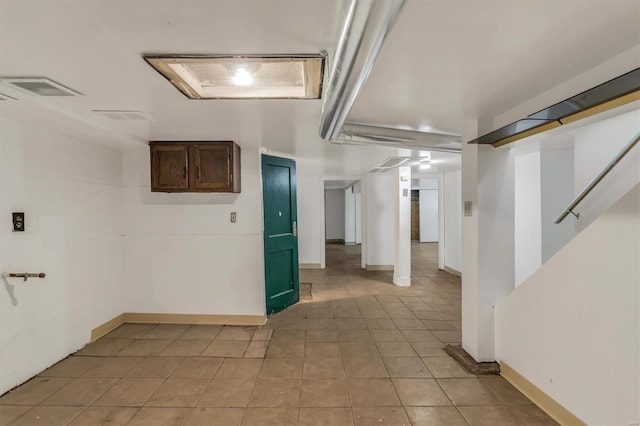 interior space with light tile patterned floors and visible vents