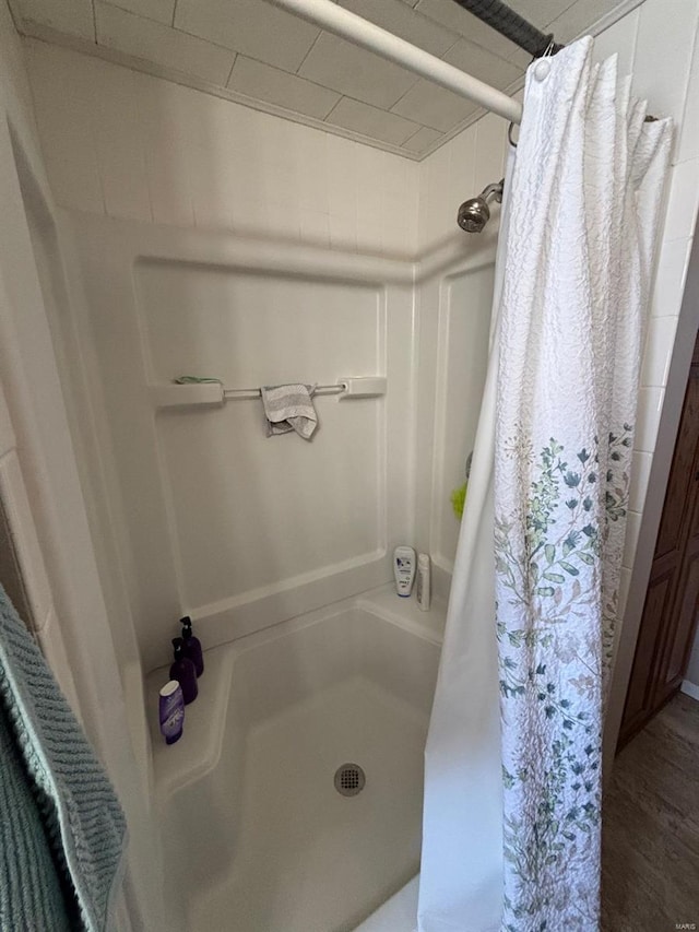 full bath with a shower stall