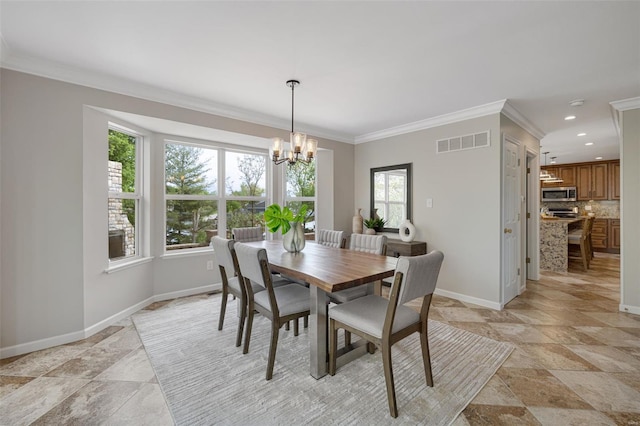 dining area with an inviting chandelier, stone tile floors, baseboards, visible vents, and ornamental molding