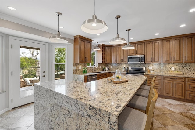 kitchen featuring brown cabinets, stainless steel appliances, light stone counters, and backsplash