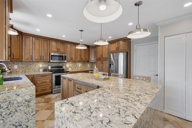 kitchen with decorative backsplash, a spacious island, brown cabinets, a sink, and stainless steel appliances