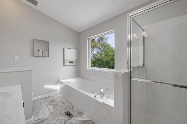 bathroom with baseboards, visible vents, a shower stall, and vaulted ceiling