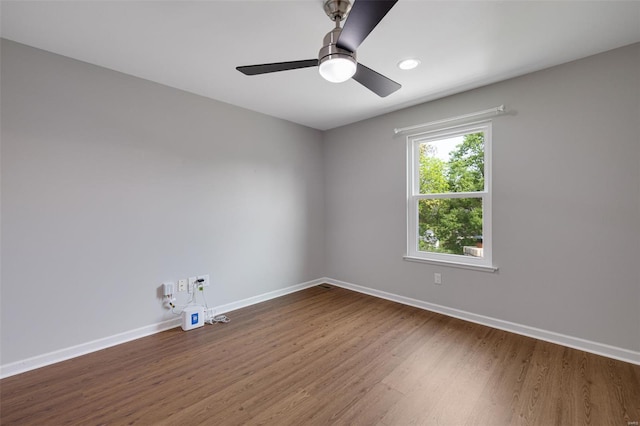 unfurnished room with baseboards, ceiling fan, recessed lighting, and wood finished floors