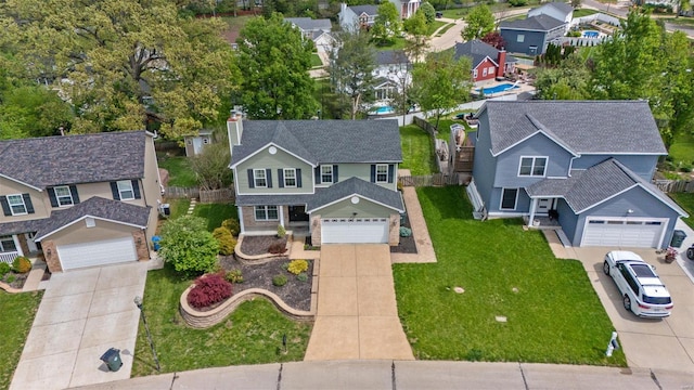 birds eye view of property with a residential view