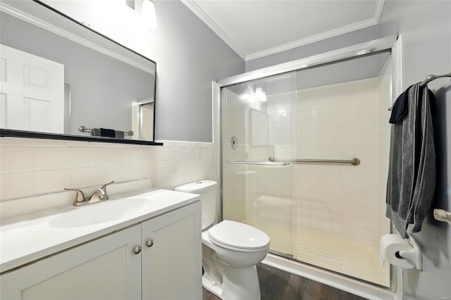 full bath featuring crown molding, tile walls, and a shower stall