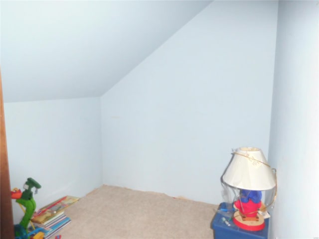 game room with carpet flooring and lofted ceiling