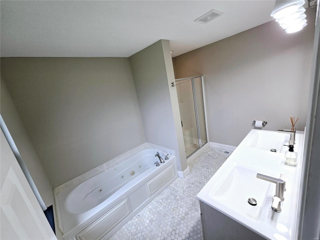 bathroom featuring a whirlpool tub, double vanity, a shower stall, visible vents, and a sink
