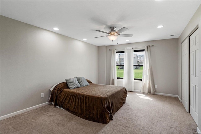 bedroom with baseboards, recessed lighting, and light carpet