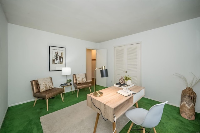 carpeted office space featuring baseboards