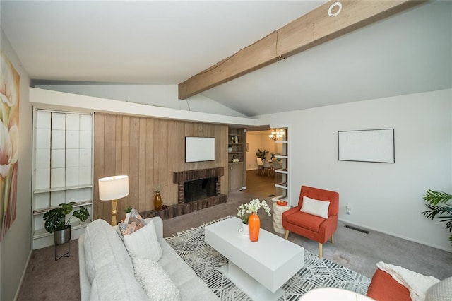 carpeted living room featuring visible vents, a fireplace, a chandelier, baseboards, and vaulted ceiling with beams