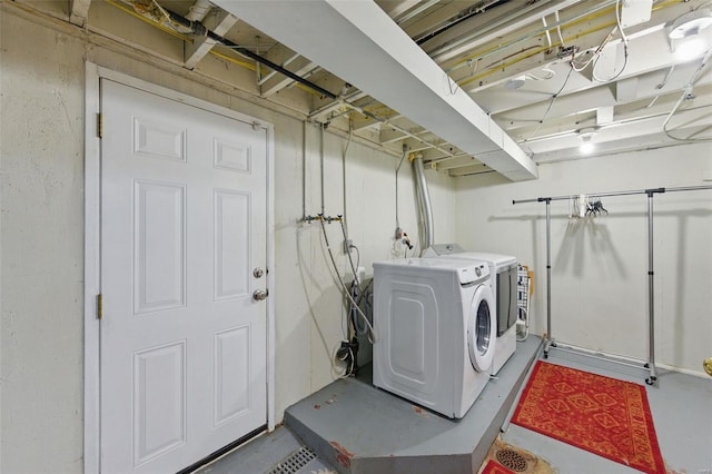 washroom with washer and dryer and laundry area