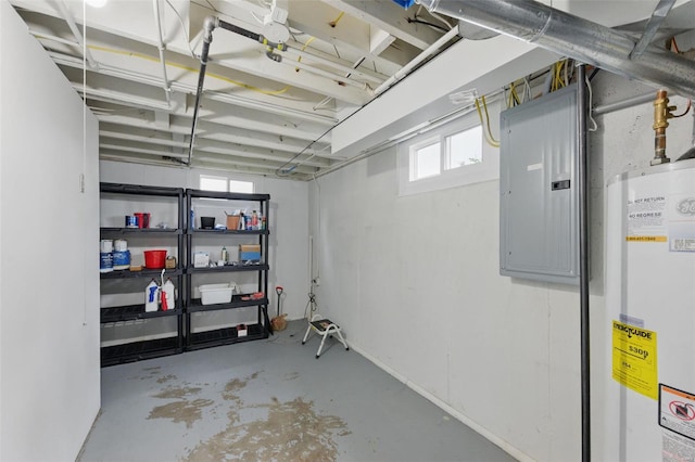 basement featuring water heater and electric panel