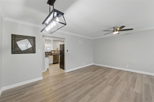 unfurnished living room with ceiling fan, crown molding, and light wood finished floors