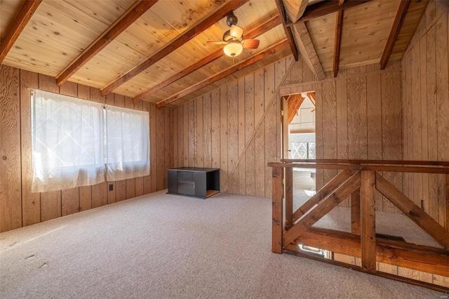 additional living space featuring wooden walls, carpet floors, vaulted ceiling with beams, and wooden ceiling