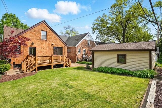 back of house with a wooden deck, stairway, brick siding, a yard, and a shingled roof