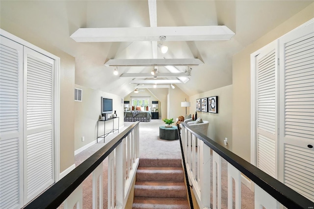 staircase with vaulted ceiling with beams, carpet flooring, baseboards, and visible vents