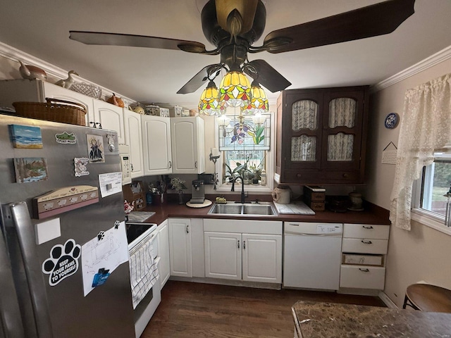 kitchen featuring a sink, a ceiling fan, white appliances, dark countertops, and white cabinets