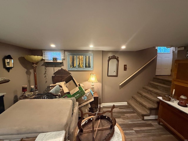 bedroom featuring baseboards, wood finished floors, and recessed lighting