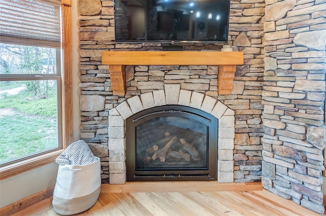 details with wood finished floors and a fireplace