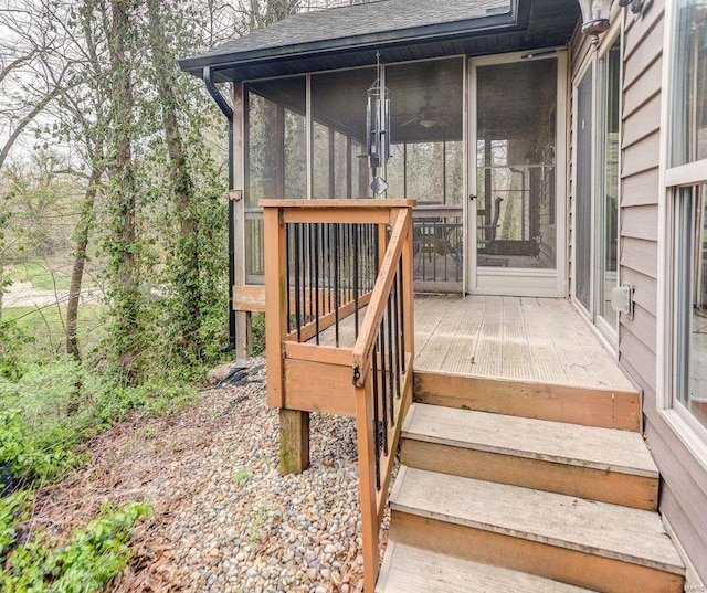 wooden deck featuring a sunroom