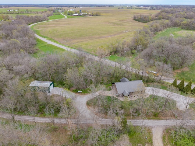 birds eye view of property with a rural view