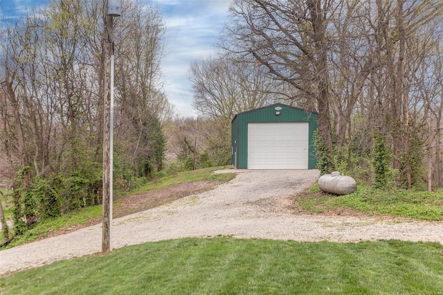 detached garage featuring driveway